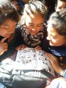 HCC Girls Reading Anti Trafficking Comics
