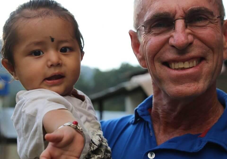 Founders Desk Bruce with Nepal Girl